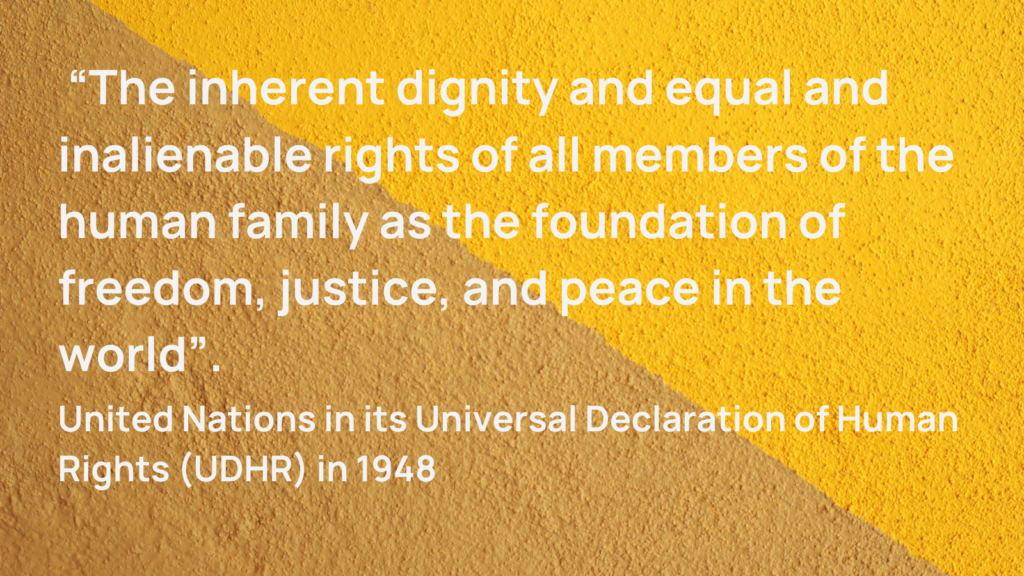 Photo of textured wall with caption  “The inherent dignity and equal and inalienable rights of all members of the human family as the foundation of freedom, justice, and peace in the world”. United Nations in its Universal Declaration of Human Rights (UDHR) in 1948