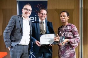 Image of award recipients collecting their award